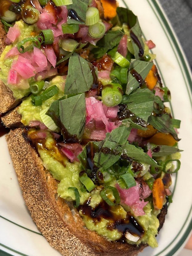 Lemongrass avocado toast with galangal, Thai basil and pickled onions at Golden Diner
