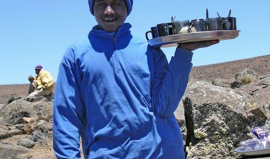 Crew member serving tea